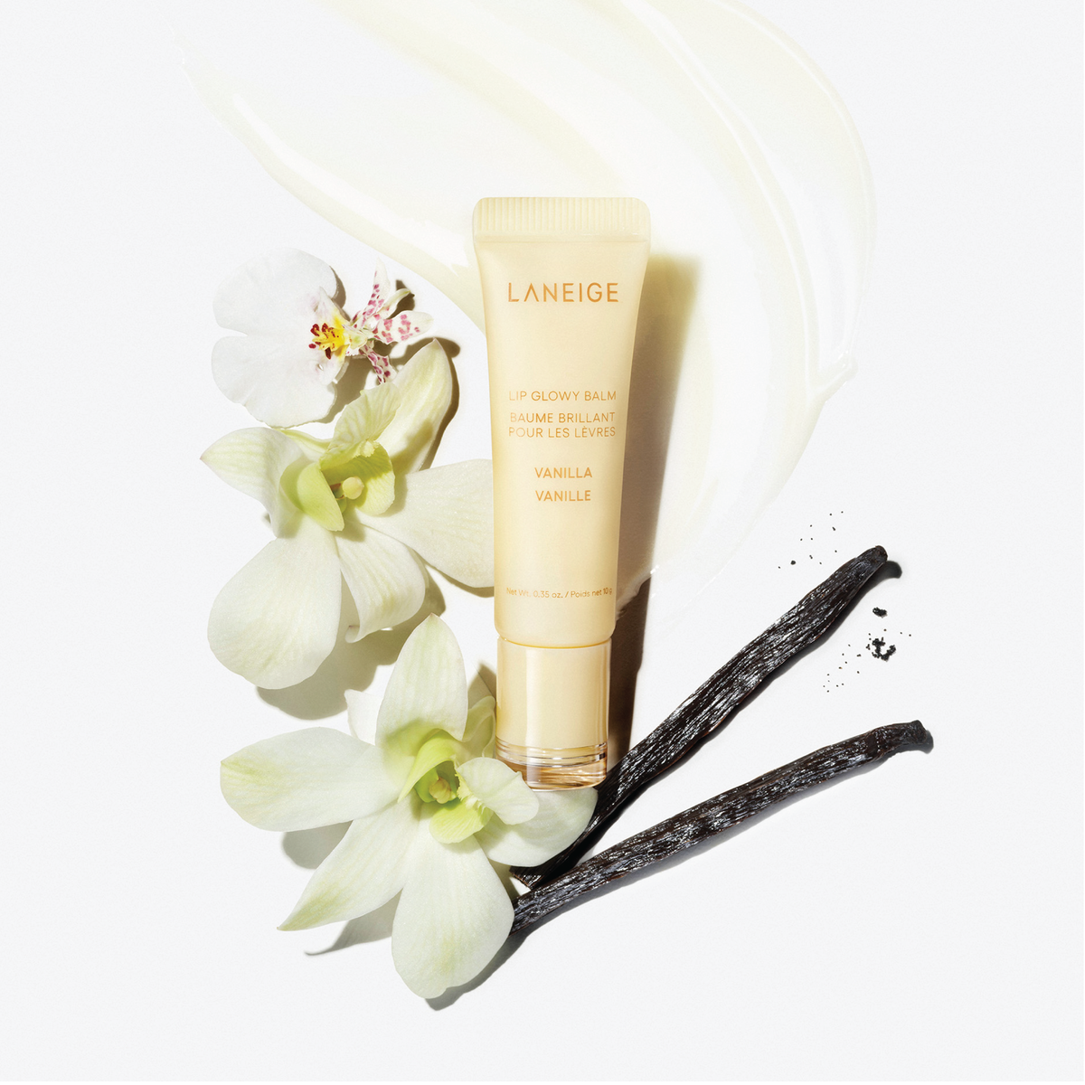 LANEIGE Lip Glowy Balm Vanilla 10g with white flowers and vanilla pods.