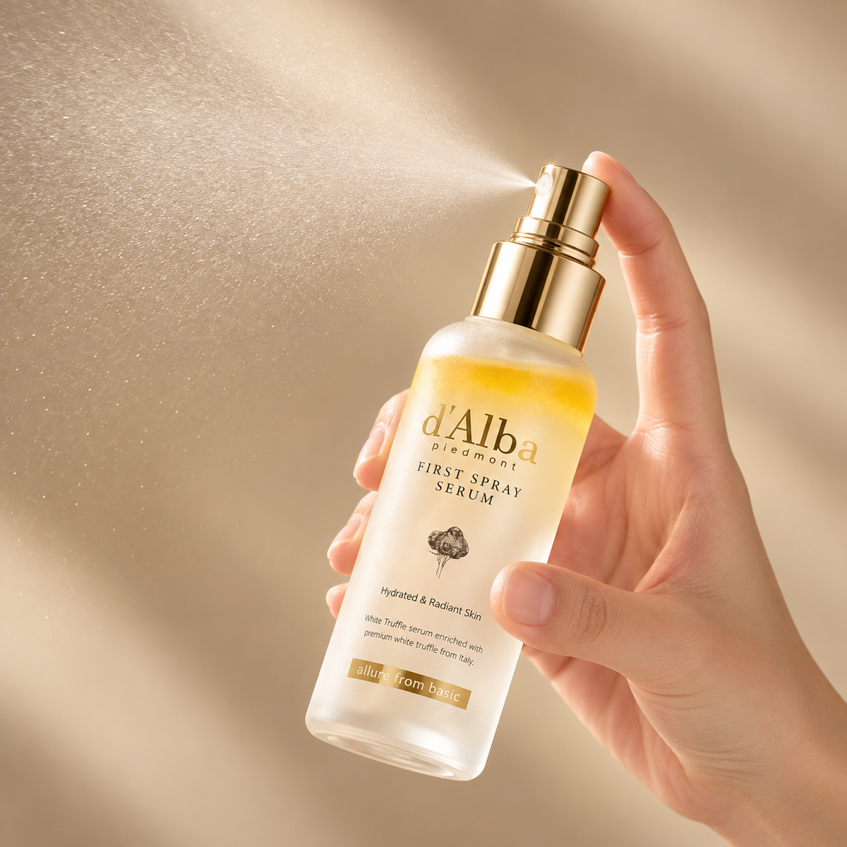 Hand holding D'ALBA White Truffle First Spray Serum bottle
