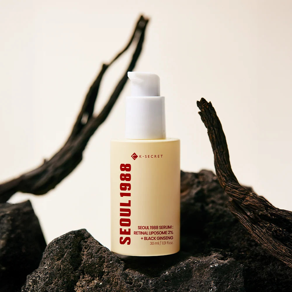 KSECRET Seoul 1988 serum bottle displayed on dark textured rocks