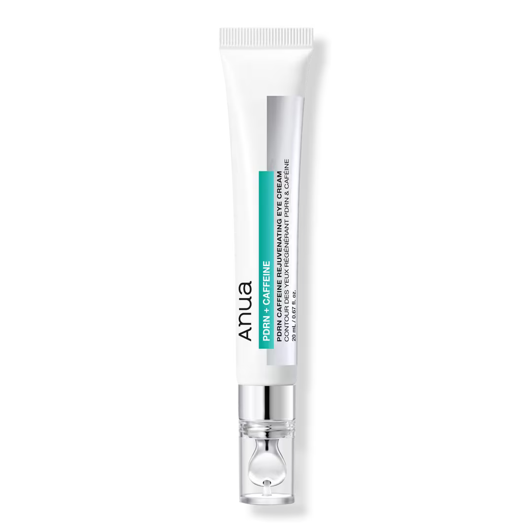 ANUA PDRN Caffeine Rejuvenating Eye Cream 20ml tube with silver massage applicator.