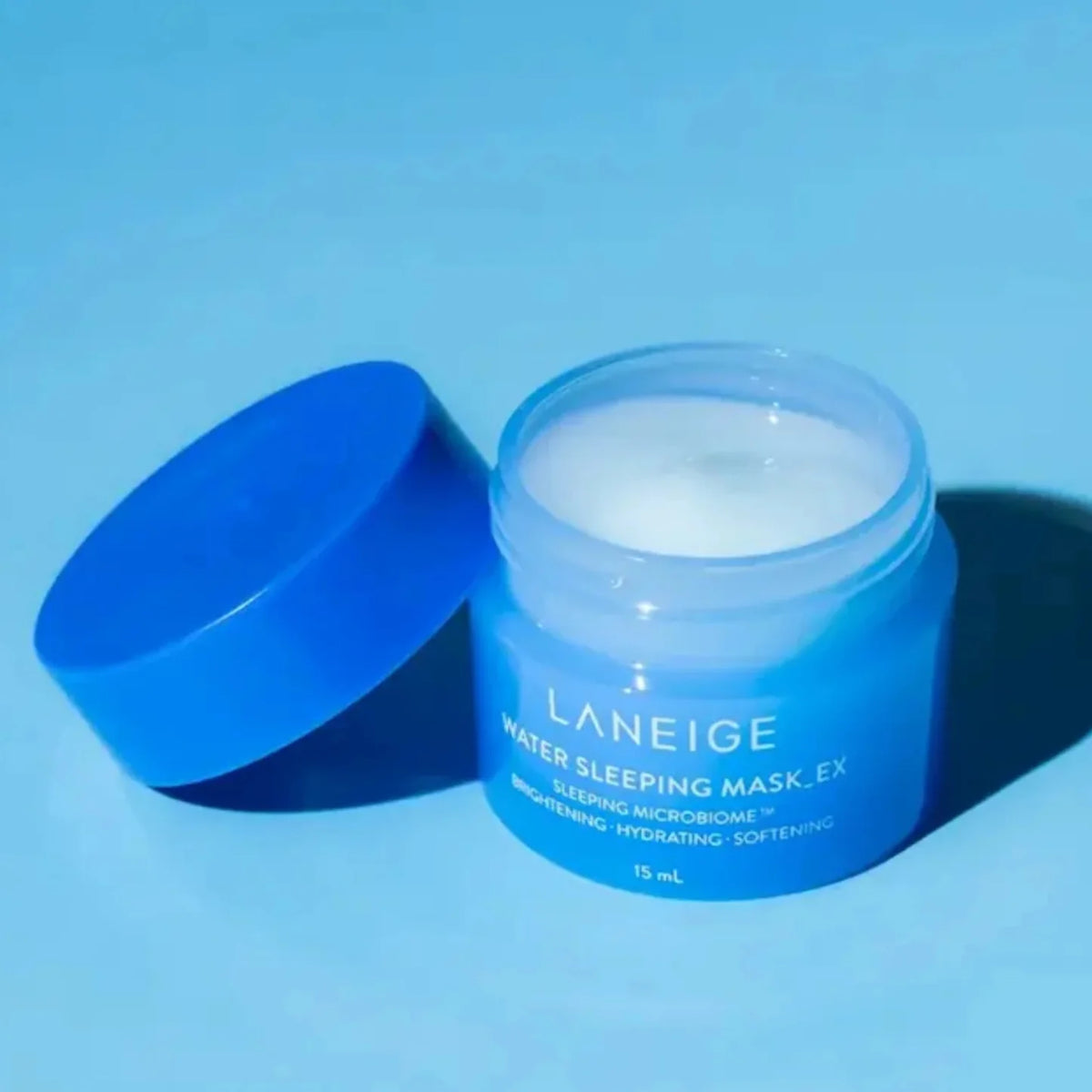 Open blue LANEIGE Water Sleeping Mask jar with lid beside it