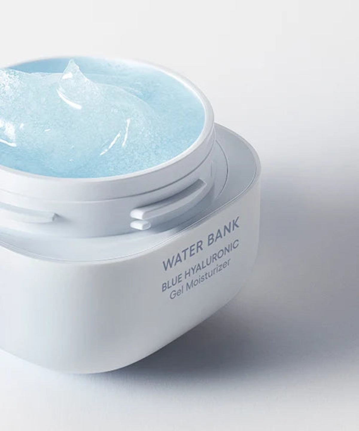Open jar: “Open jar of LANEIGE Water Bank Blue Hyaluronic Gel Cream showing pale blue cream